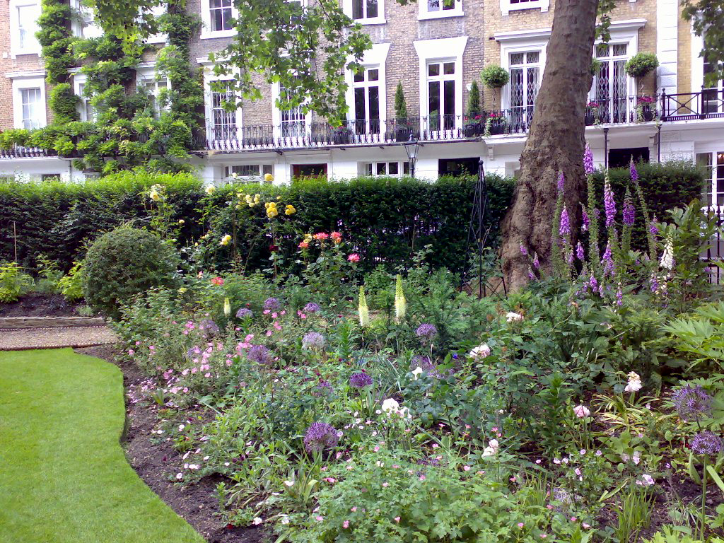 View of kitchen garden with school playgorund in background